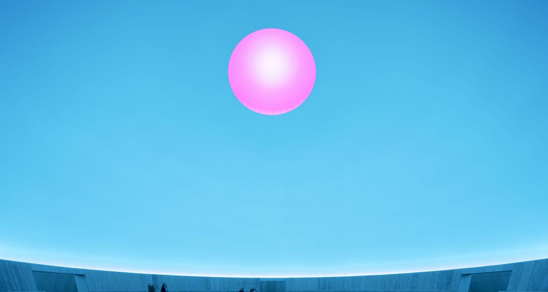 a large-scale light exhibition by James Turrell featuring a pink hole in a blue dome