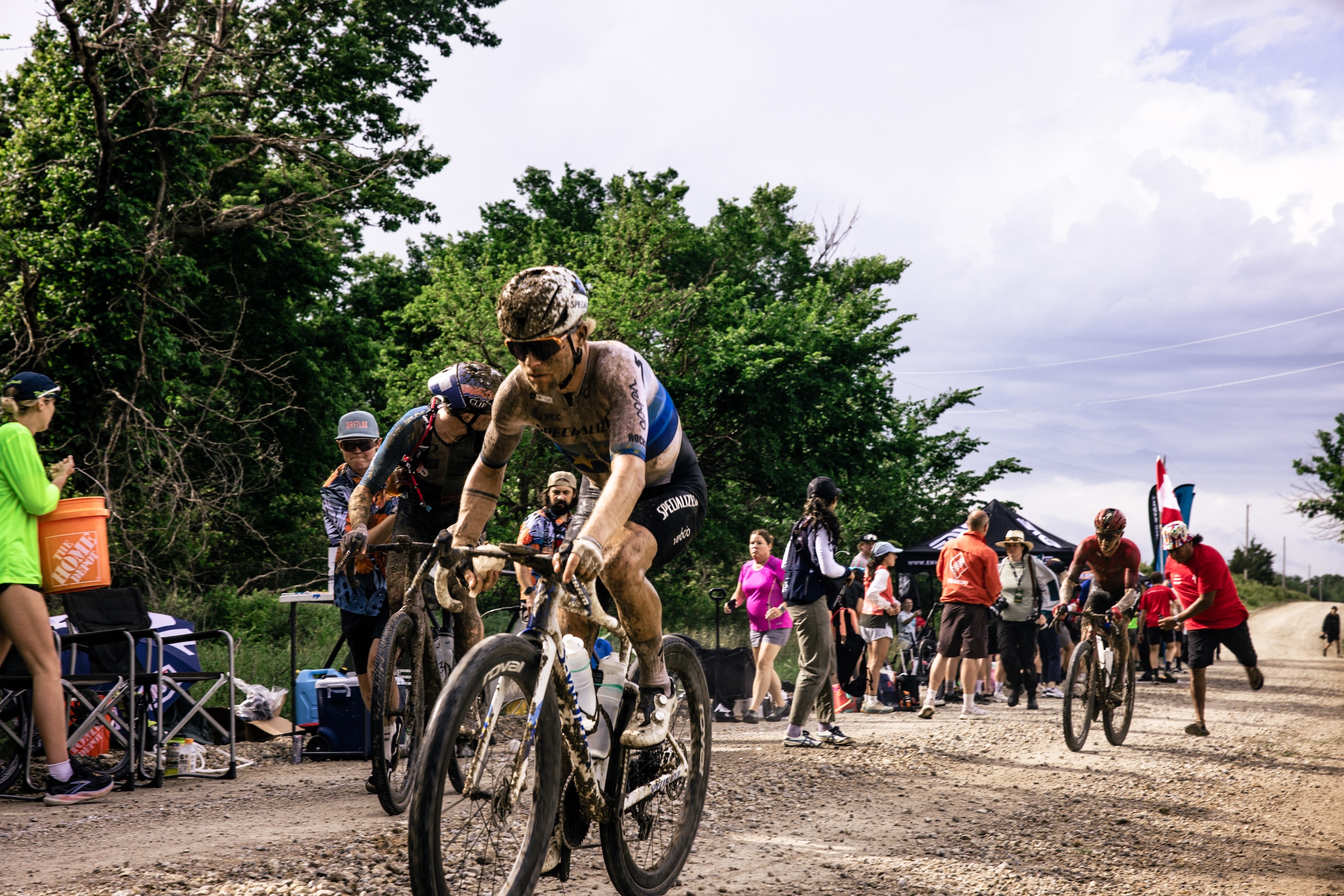 Mads Wurtz Schmidt, Daxton Mock and Keegan Swenson at Feed Zone 1 at 2026 Unbound Gravel 200