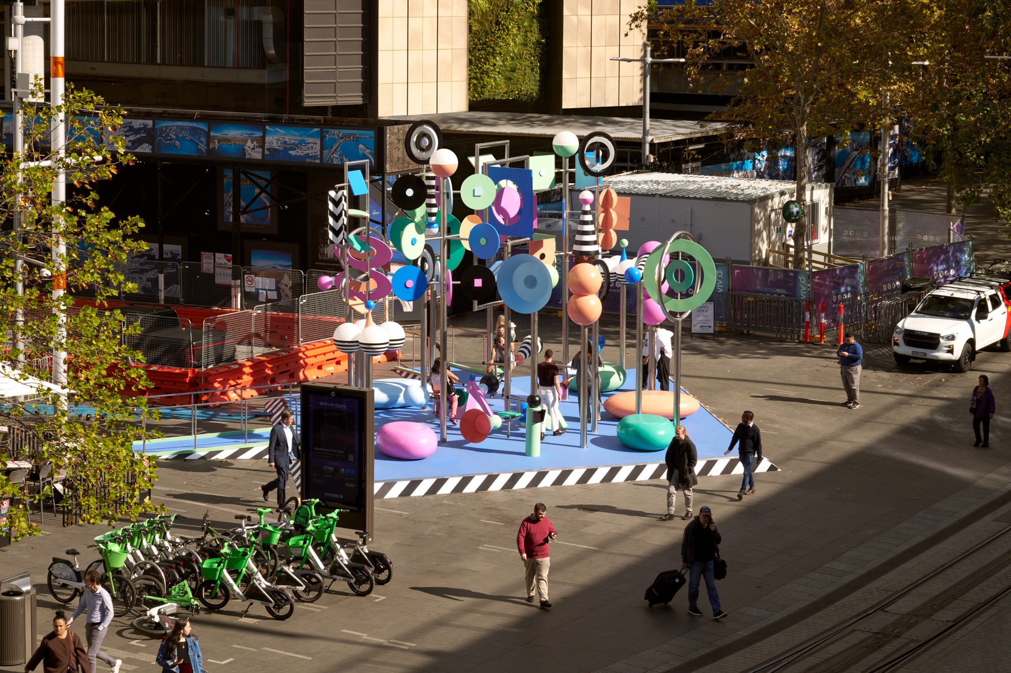 a photo of a colorful outdoor sculpture with twirling shapes by Wade and Leta