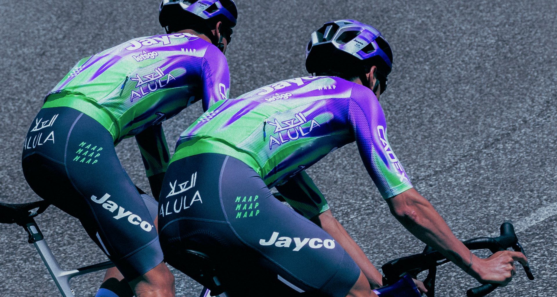 'Unexpected' pop of 'electric' green with purple flames featured in swap-out kits for Jayco AlUla for men's and women's Tour de France