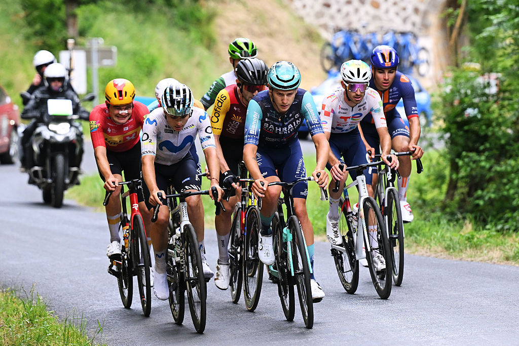 The day's breakaway riding with motorbikes behind