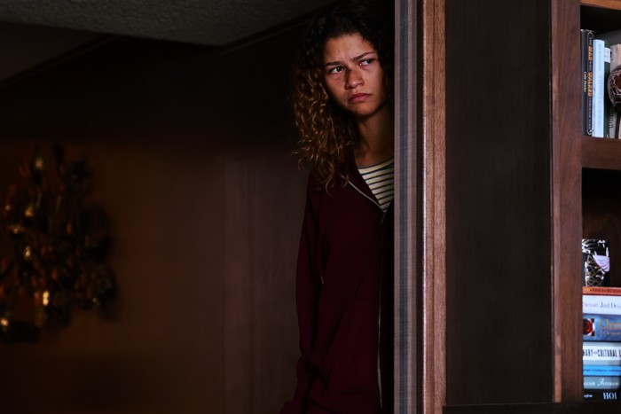 euphoria-zendaya_7 Zendaya lurks behind a doorway as Rue Bennett in the Euphoria season 3 finale.