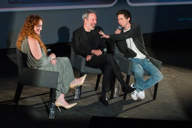 BURBANK, CALIFORNIA - JULY 08: Moderator Brittany Broski, Denis Villeneuve, and Timothée Chalamet attend the