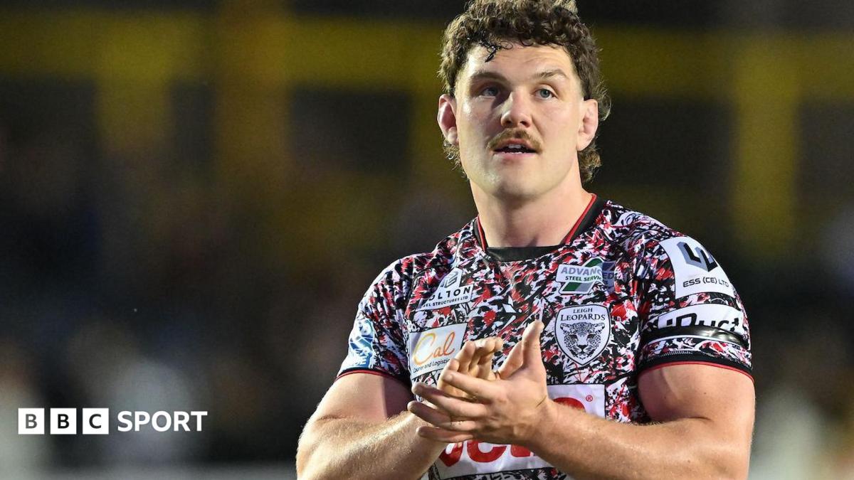 Robbie Mulhern claps the Leigh Leopards fans after a Super League match at Castleford Tigers