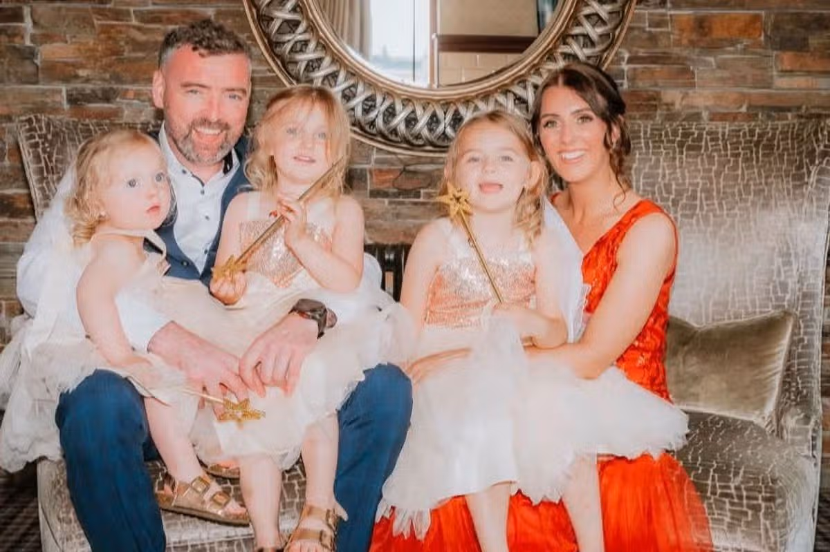 Paul Collins with his wife Donna and three young daughters - Sadie, Carly and Millie