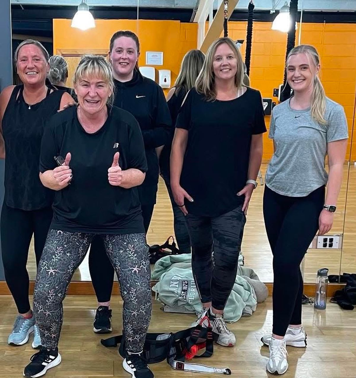 Olivia, right, with Helene, second from left, at Helene's bungee fitness class