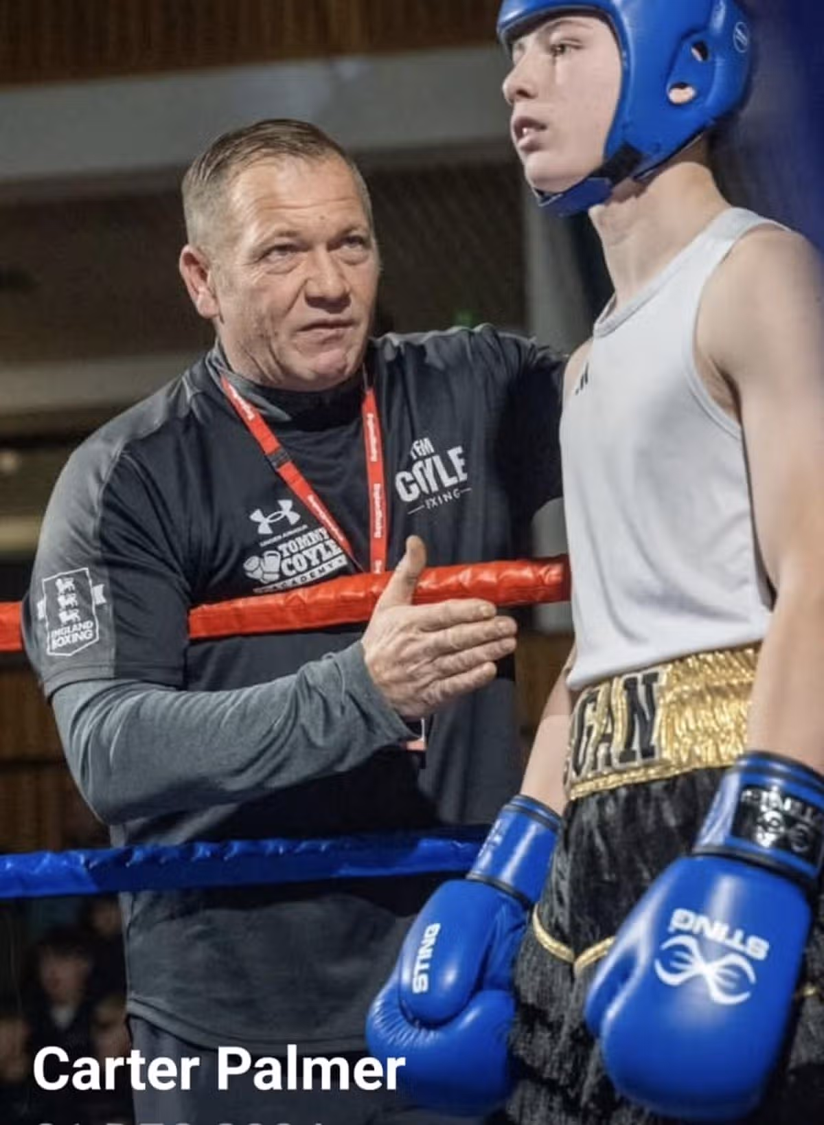 Logan in the ring with his dad, Carter, who coaches