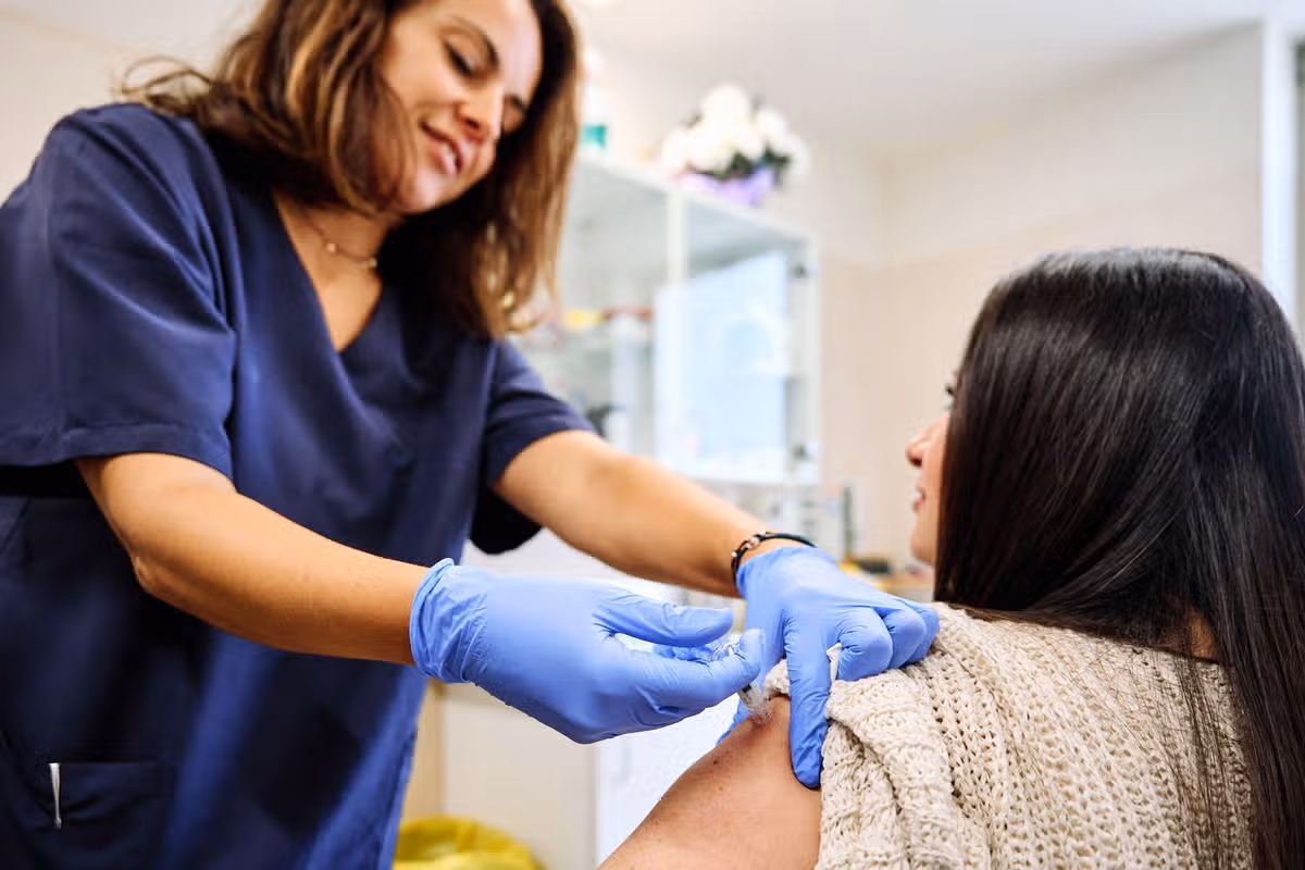 young woman receiving an injection