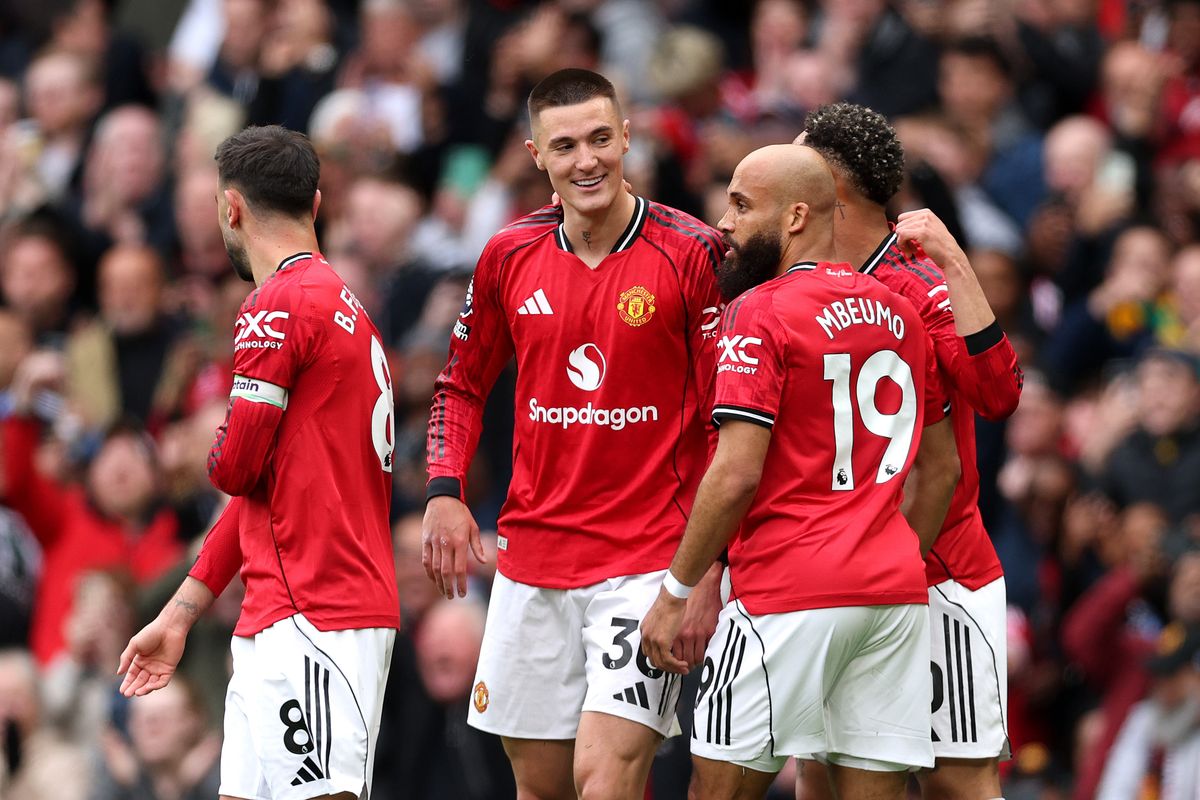 Benjamin Sesko of Manchester United celebrates scoring his team's second goal with teammates during the Premier League match between Manchester United and Liverpool at Old Trafford on May 03, 2026 in Manchester, England. 
