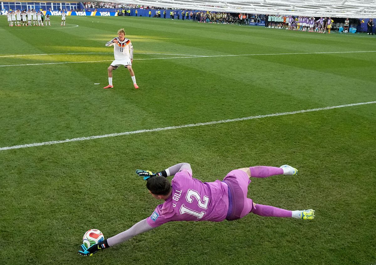 Orlando Gill of Paraguay saves the Germany's fourth penalty taken by Nick Woltemade
