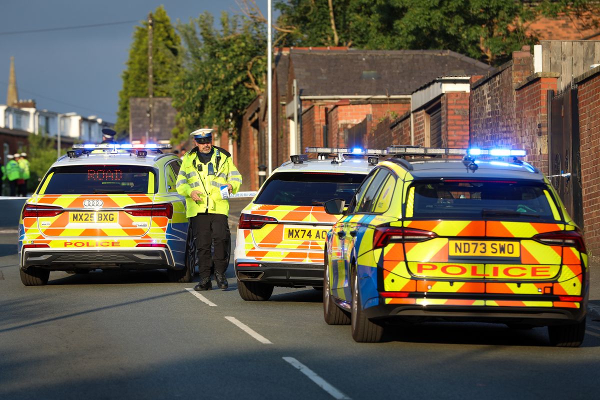 Officers conducting investigations at the scene