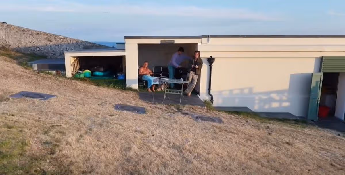 Snips taken from Facebook video on Bear Grylls account of drone shots of Saint Tudwal Island West off the coast at Abersoch that he owns - Bear's video starts in his man-cave with children Huckleberry and Jesse