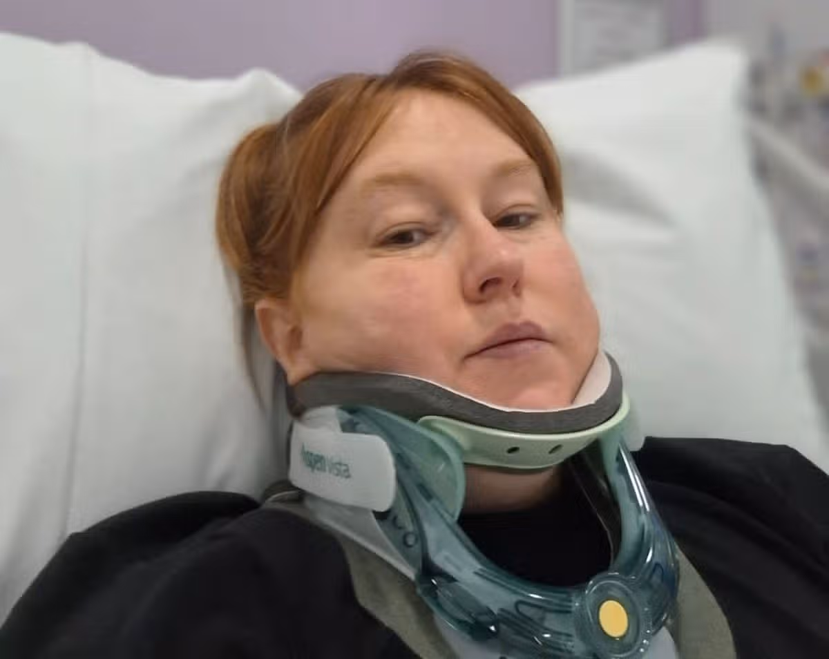 Chantelle in medical collar in hospital bed