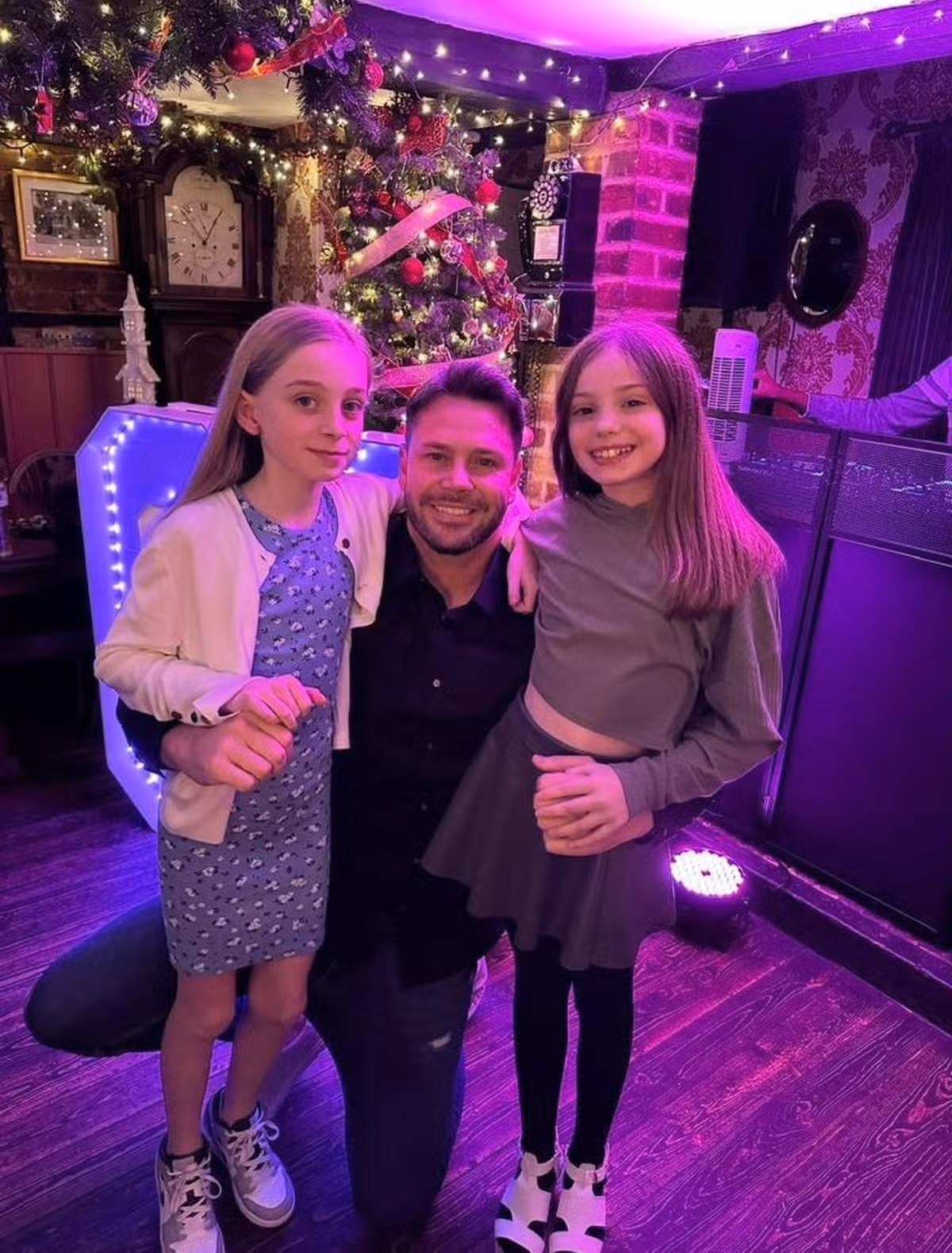 Kevin Fasting Junior with his two daughters Sienna and Isabella