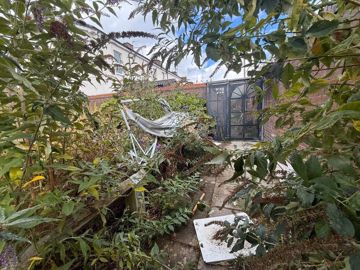 Fly-tipped objects strewn on across the green space