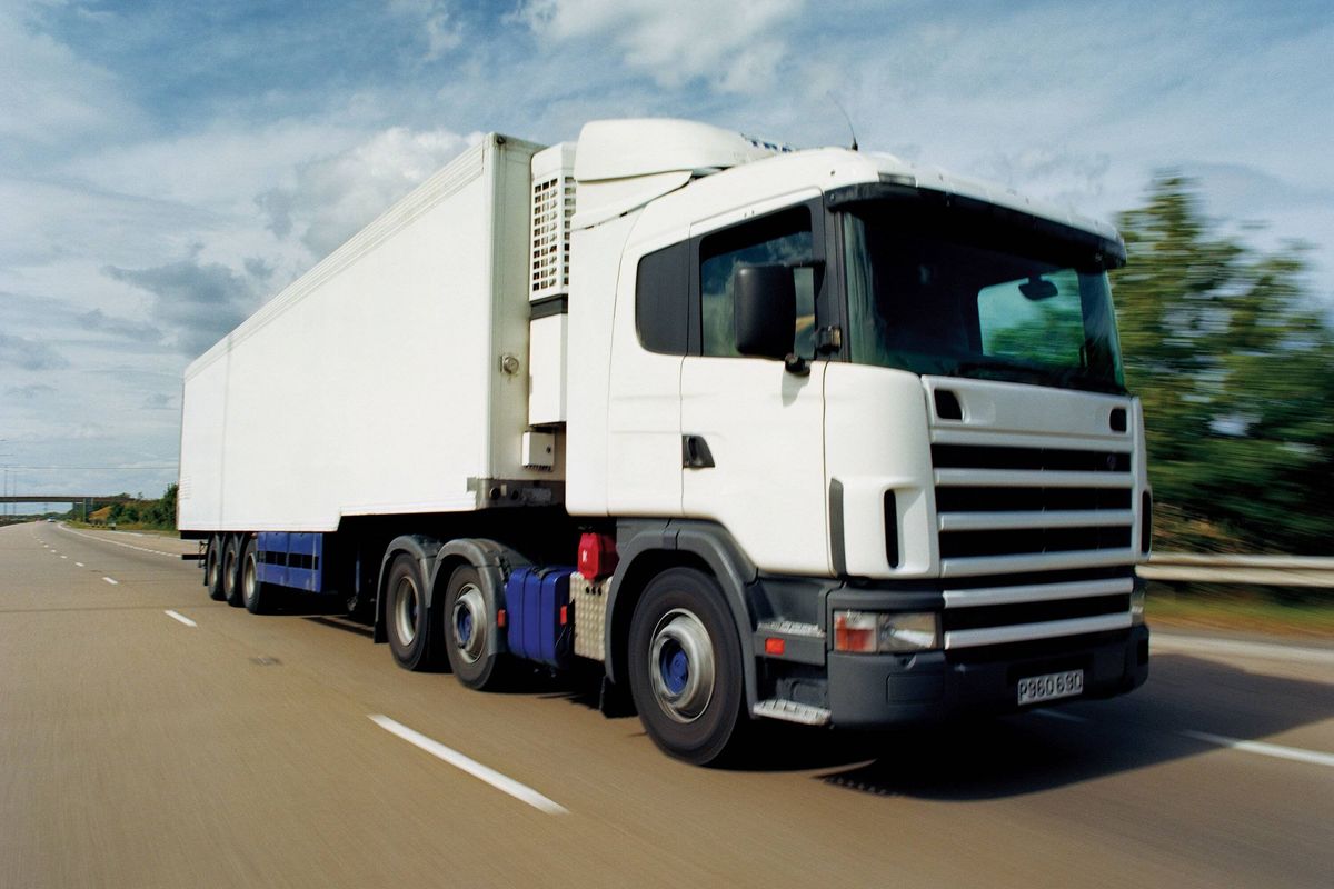 Lorry Moving Along a Motorway, Immingham, Humberside, UK