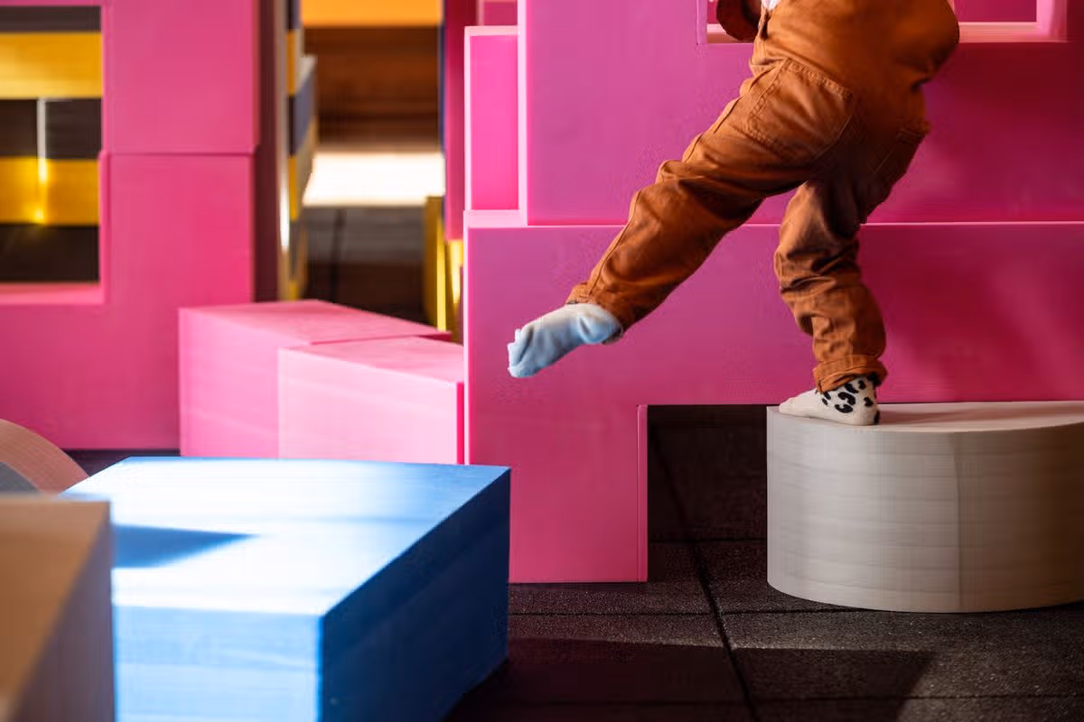 Children playing with the Playshapes installation