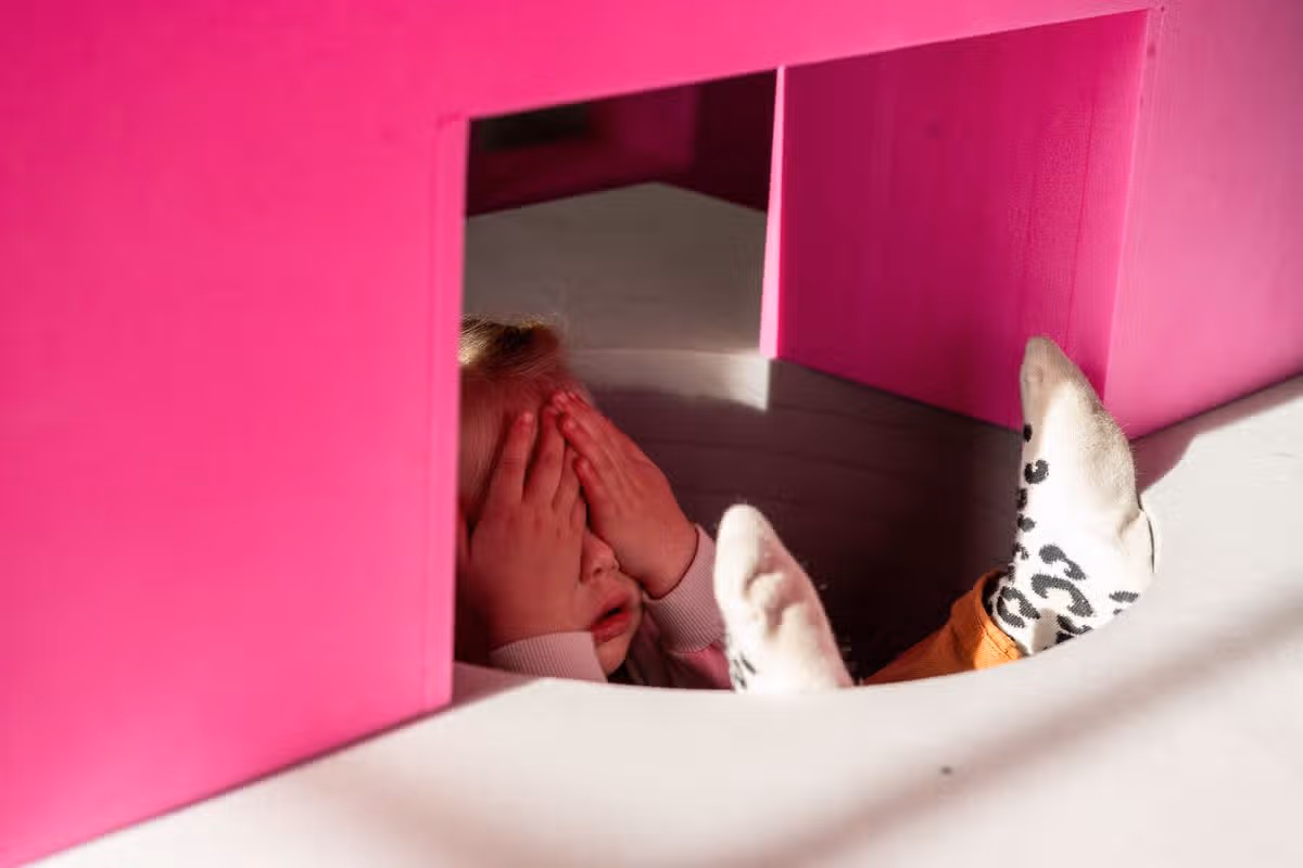 Children playing with the Playshapes installation
