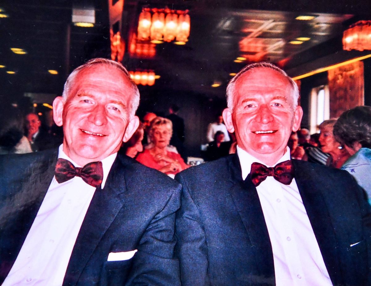 The brothers wearing a matching suit and bowtie