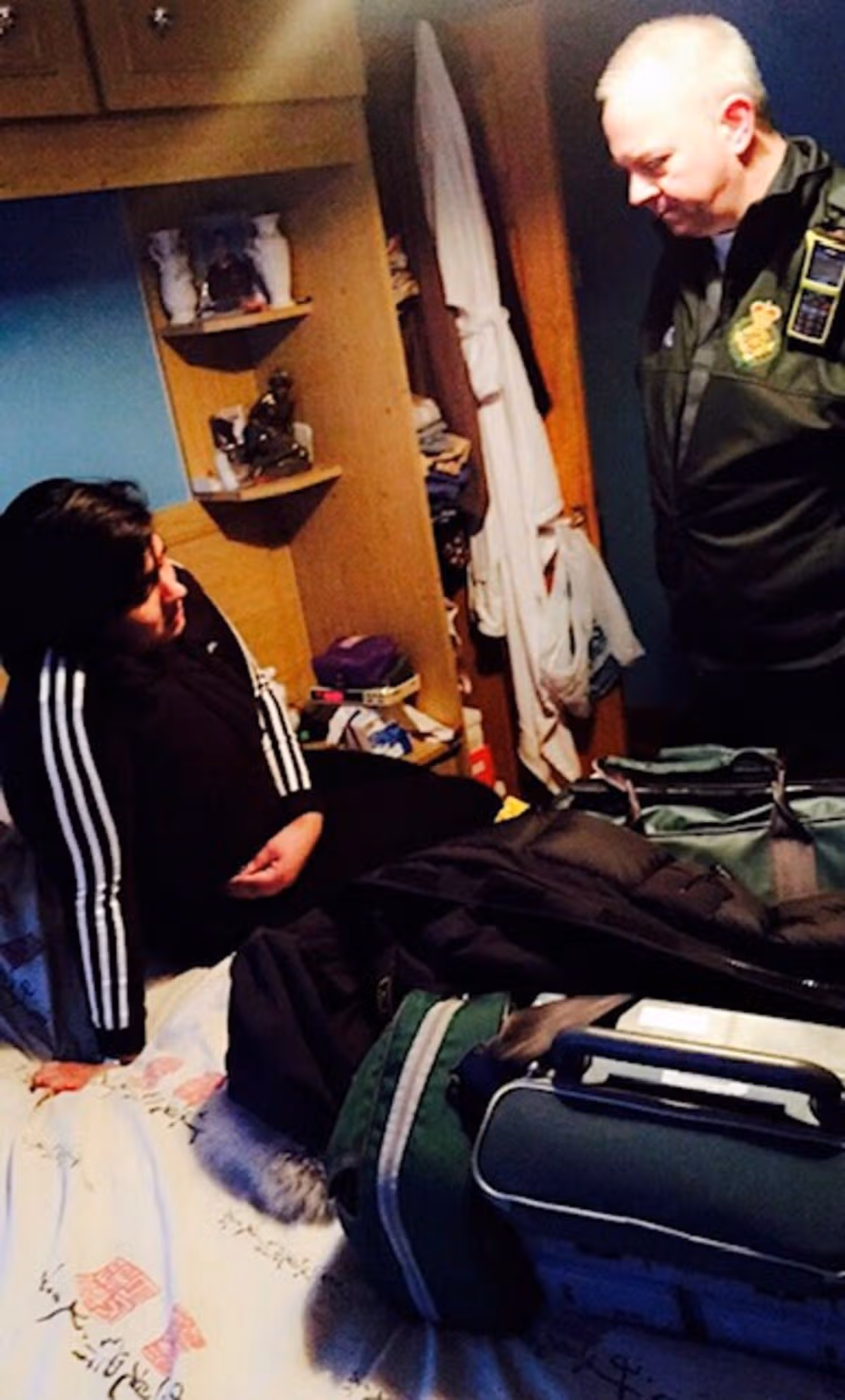 Amandeep being assessed by a paramedic