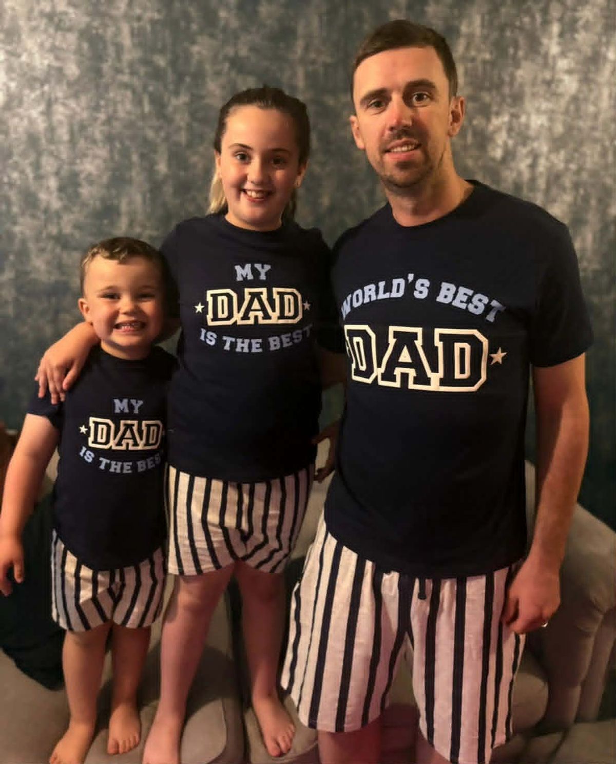 John with two of his three children who he can't bare the thought of leaving behind