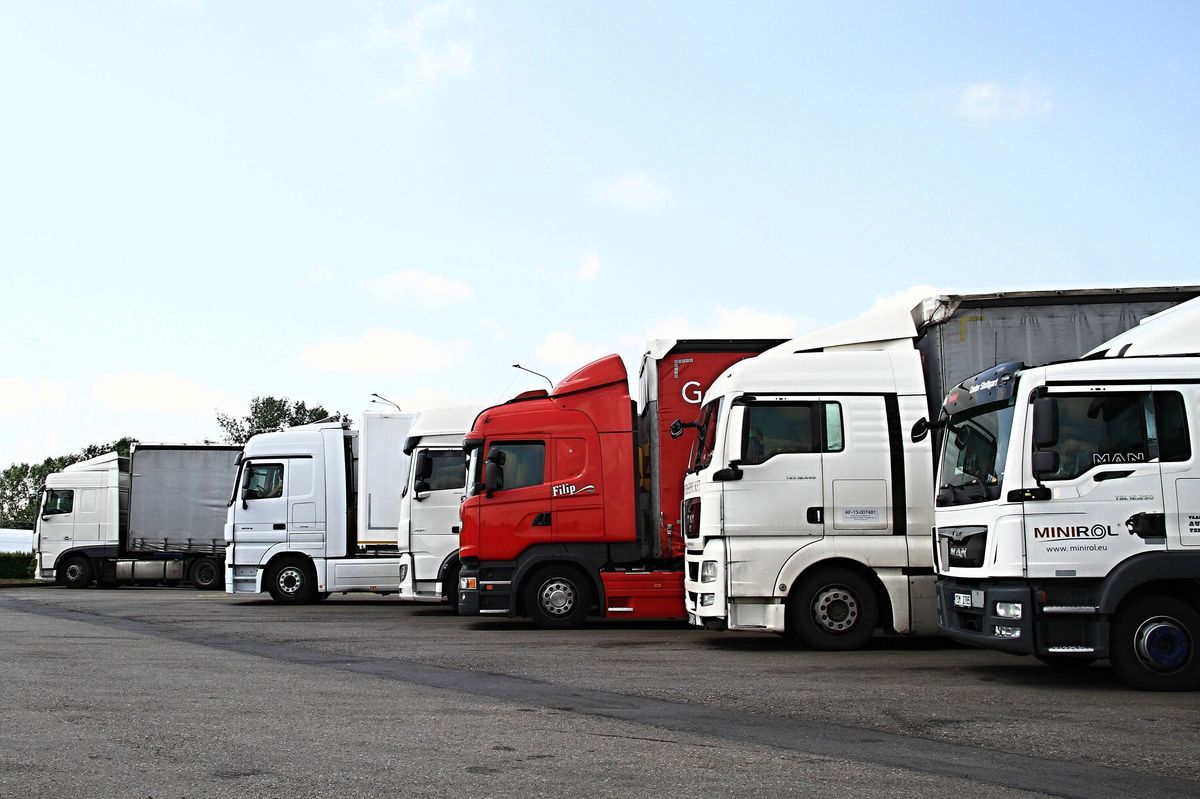 lorries parked up outside a company's car parking area