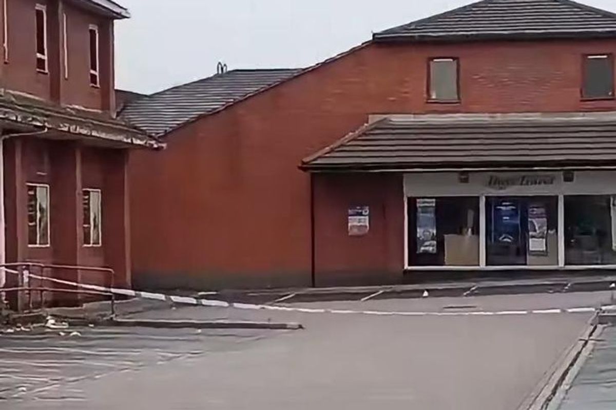 A cordon on the car park outside Co-op and Hays Travel in Royton