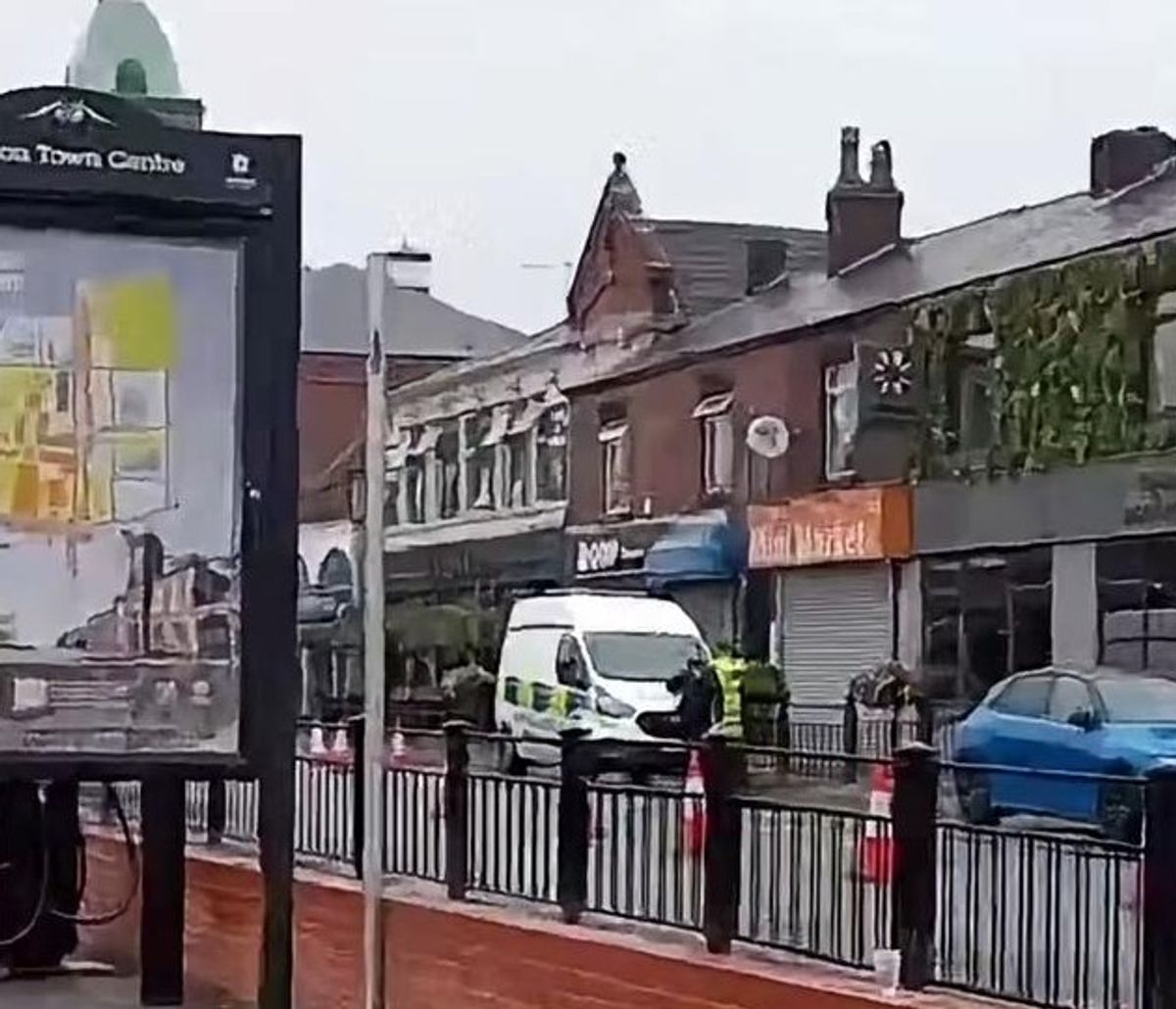 Police seen in attendance on Rochdale Road, Royton