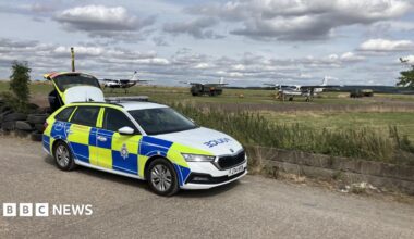 A police car parked near an airfield in Nottinghamshire