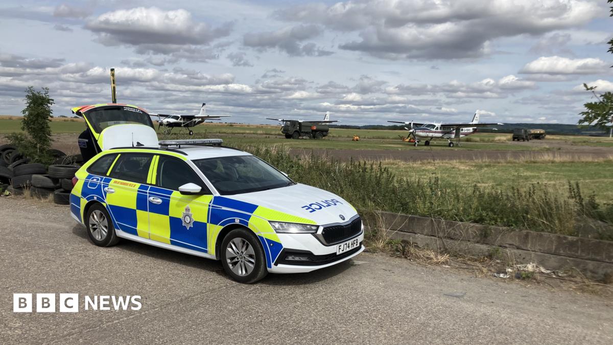 A police car parked near an airfield in Nottinghamshire