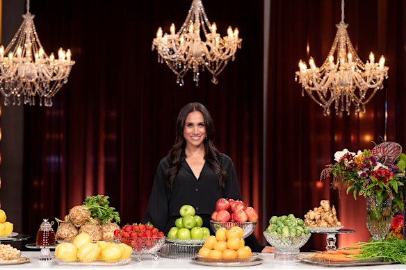 Meghan and her impressive table of produce under the chandeliers.