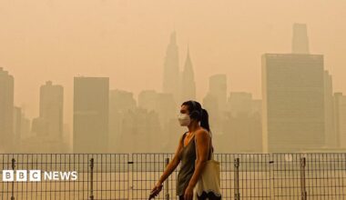 Smoke from massive wildfires in Canada engulfed the New York City skyline, reducing visibility and casting an orange haze over the New York City