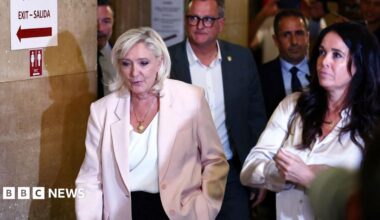 French court clears way for Marine Le Pen to run for president but orders her to wear electronic tag
