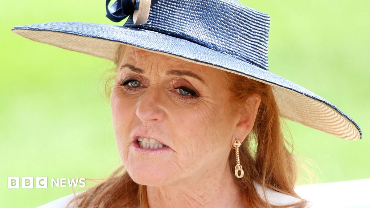 Sarah Ferguson attends day two of Royal Ascot 2024 at Ascot Racecourse on June 19, 2024 in Ascot, England, wearing a white and blue sun hat and gold earrings