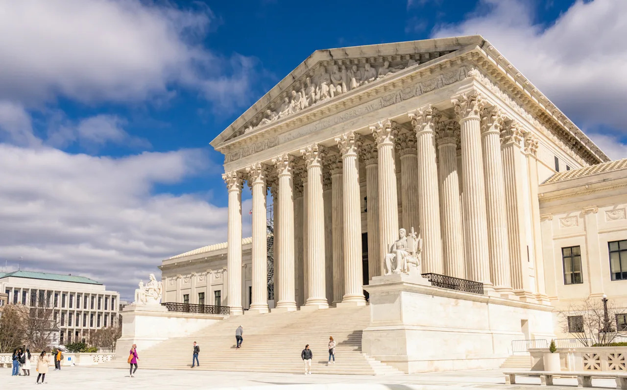 Washington DC, USA - Sunny springtime weather in March as people visit the Supreme Court building.