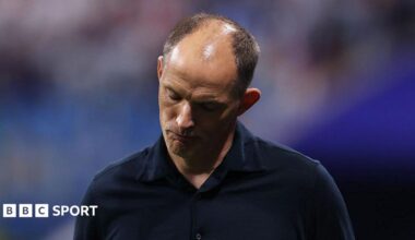 Thomas Tuchel, manager of England, bows his head during the FIFA World Cup 2026 semi-final match between England and Argentina