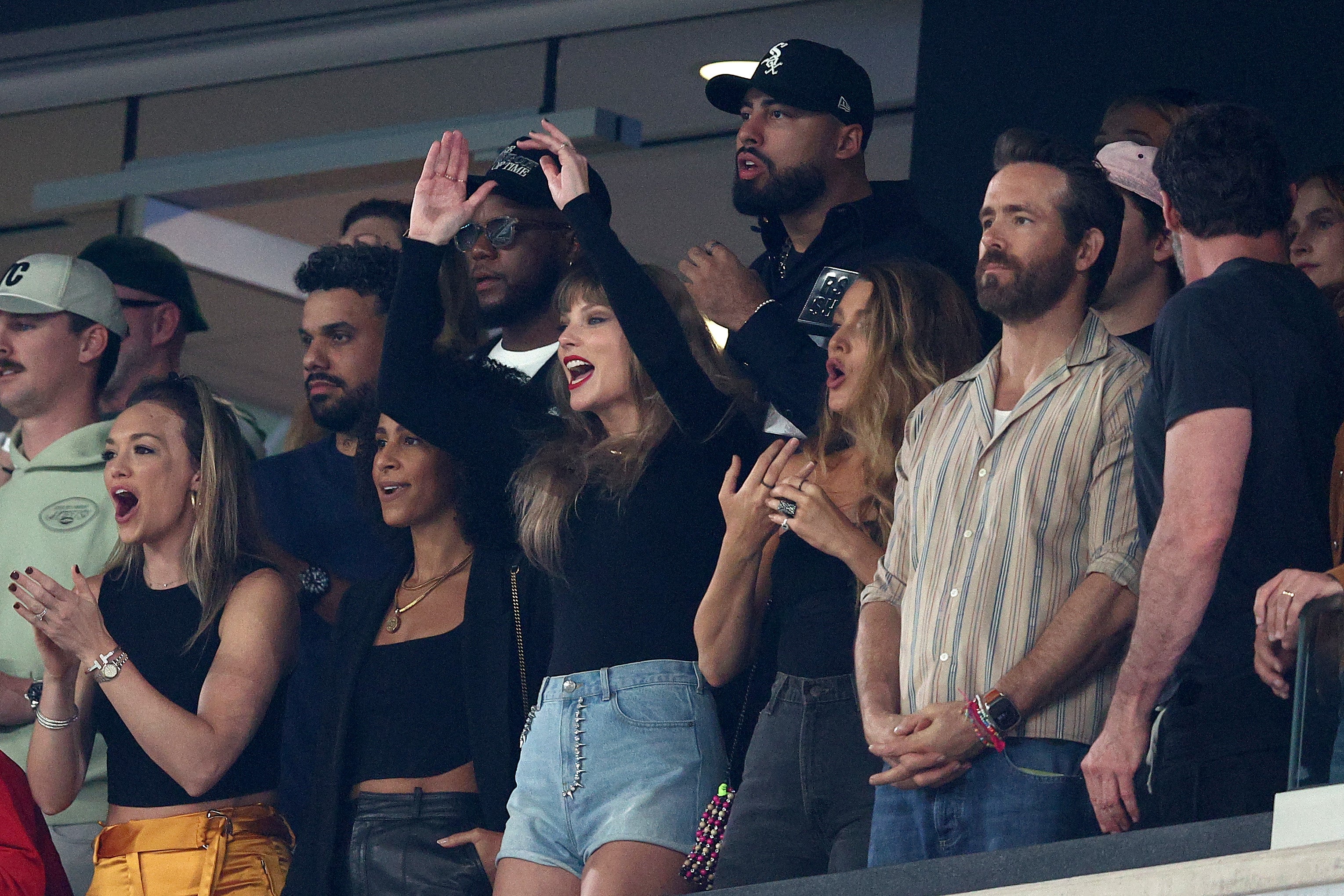 Swift, Lively and Reynolds watching a game between the Kansas City Chiefs and the New York Jets in October 2023