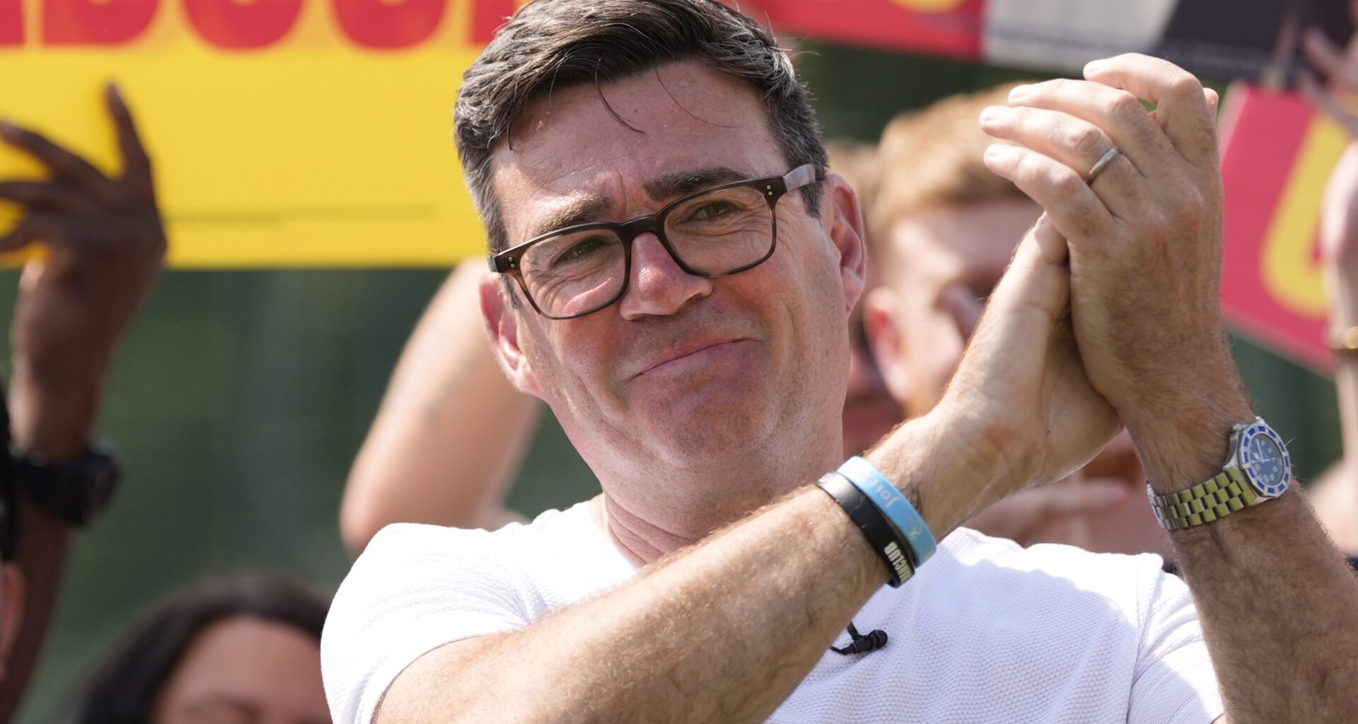 Andy Burnham speaking in Manchester, showcasing leadership and urban development initiatives in the city.