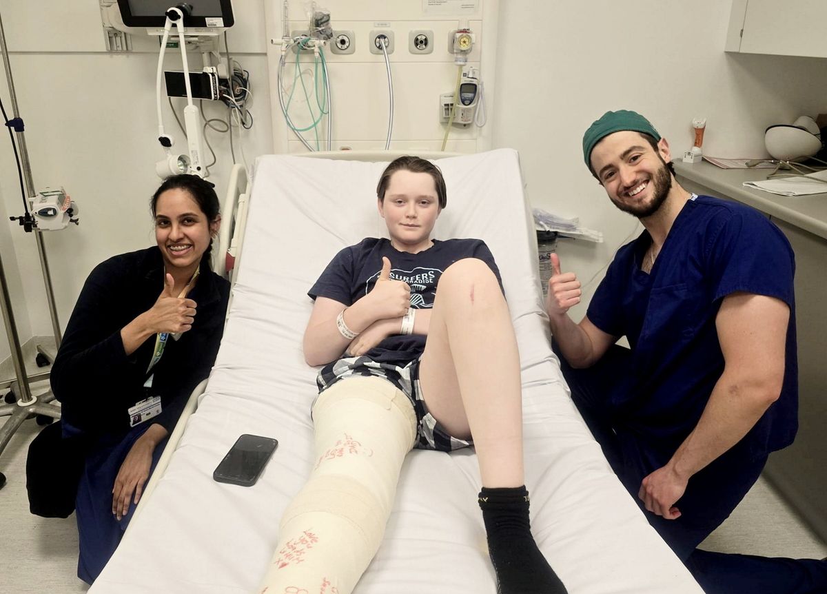Jacob Butler, 14, with Dr Ashka (L) and Dr Jamal (R)