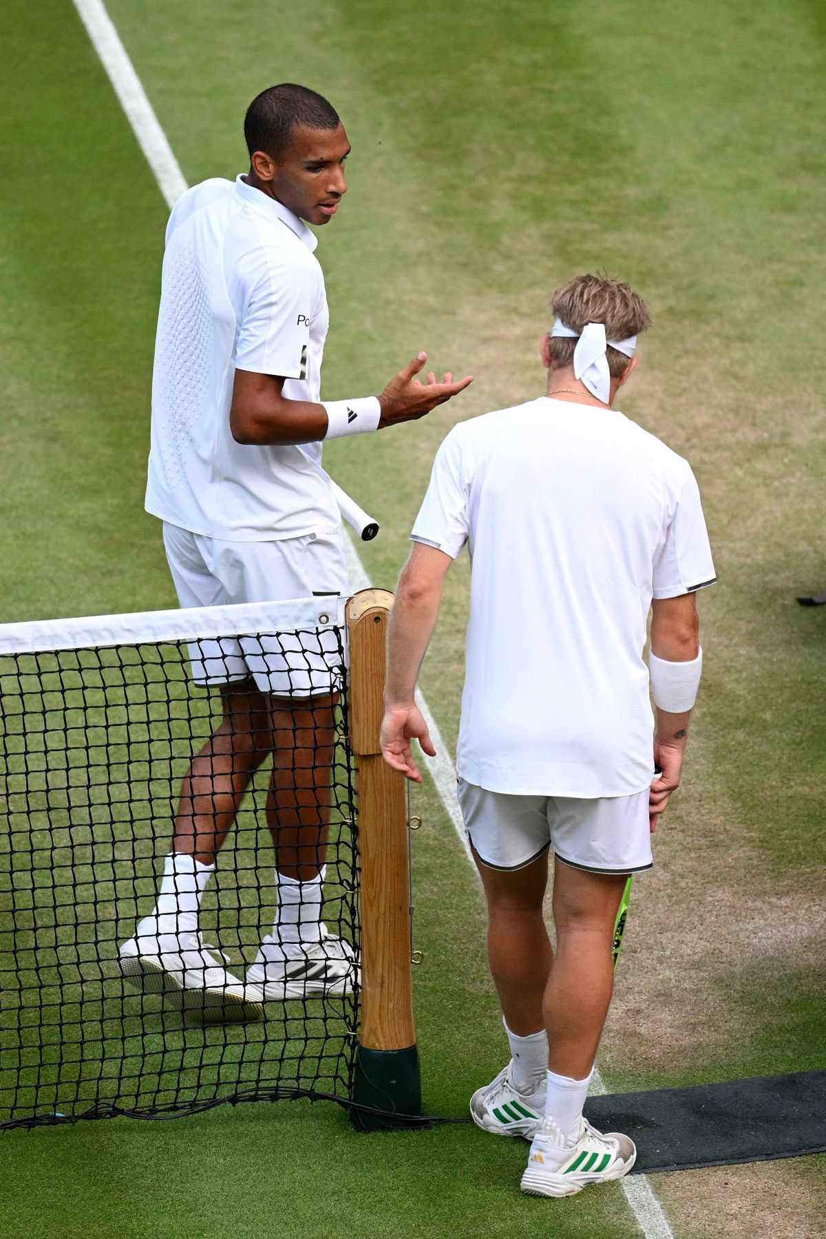 LONDON, ENGLAND - JULY 05: Felix Auger-Aliassime of Canada and Alejandro Davidovich Fokina of Spain interact following their Gentlemen's Singles fourth round match on day seven of The Championships Wimbledon 2026 at All England Lawn Tennis and Croquet Club on July 05, 2026 in London, England. (Photo by Matthias Hangst/Getty Images)