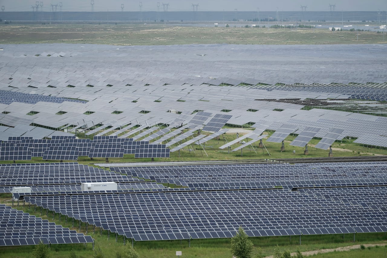 A solar farm in western China's Qinghai province. China is building some of the world's largest solar facilities to transition away from fossil fuels and protect itself from oil price shocks, like the one caused recently by the Iran war.
