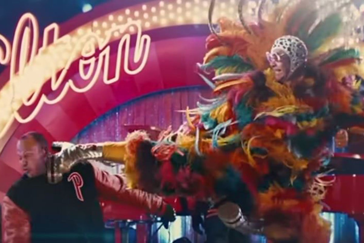 Top movie stuntmen sue over clip of Elton John kicking them in the face