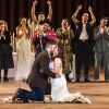 Oscar Diaz and Janelly Mendoza (kneeling), from Laredo, TX, were married on stage after a performance of Romeo and Juliet at the Public Theater's Delacorte Theater.