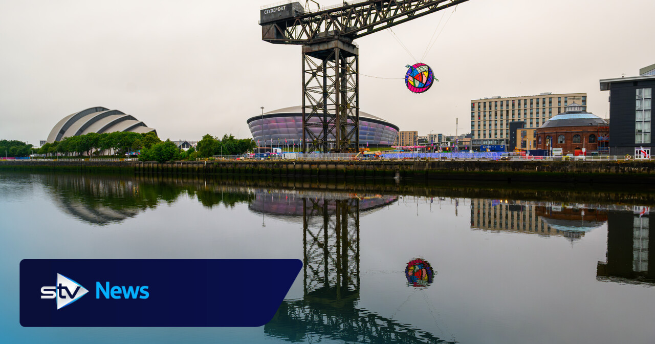 Charles Rennie Mackintosh-inspired Commonwealth Games artwork hung from Finnieston Crane