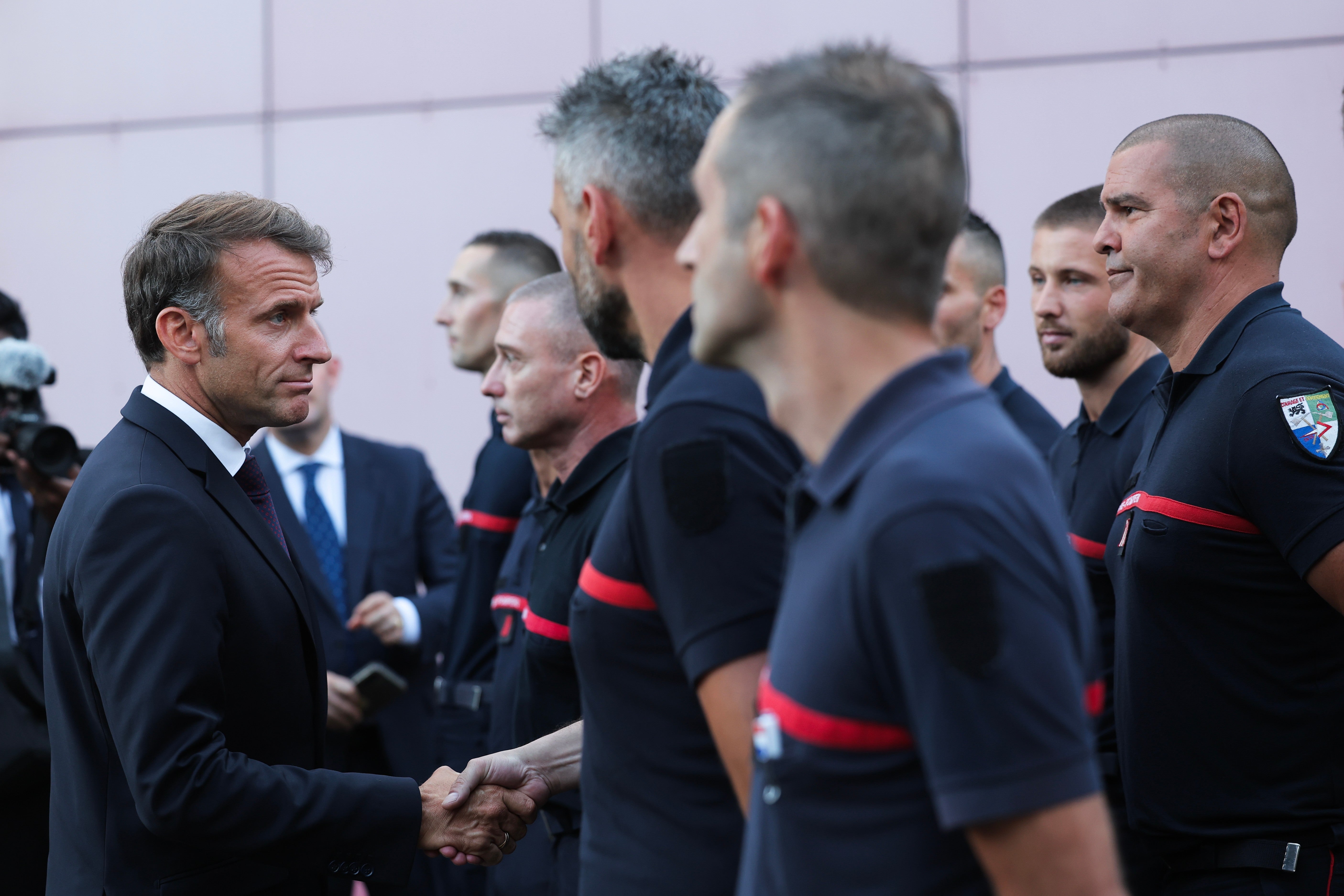 Emmanuel Macron, left, visits the departmental fire and rescue operational center (CODIS) in Bordeaux, France