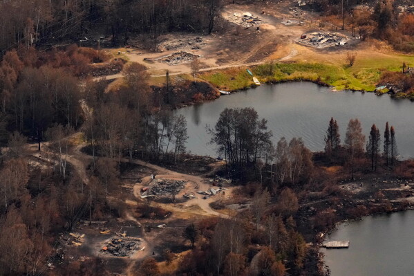 Debris from wildfire damage is visible at Collins First Nation in northwestern Ontario, Canada, July 22, 2026. (Chris Young/The Canadian Press via AP, File)