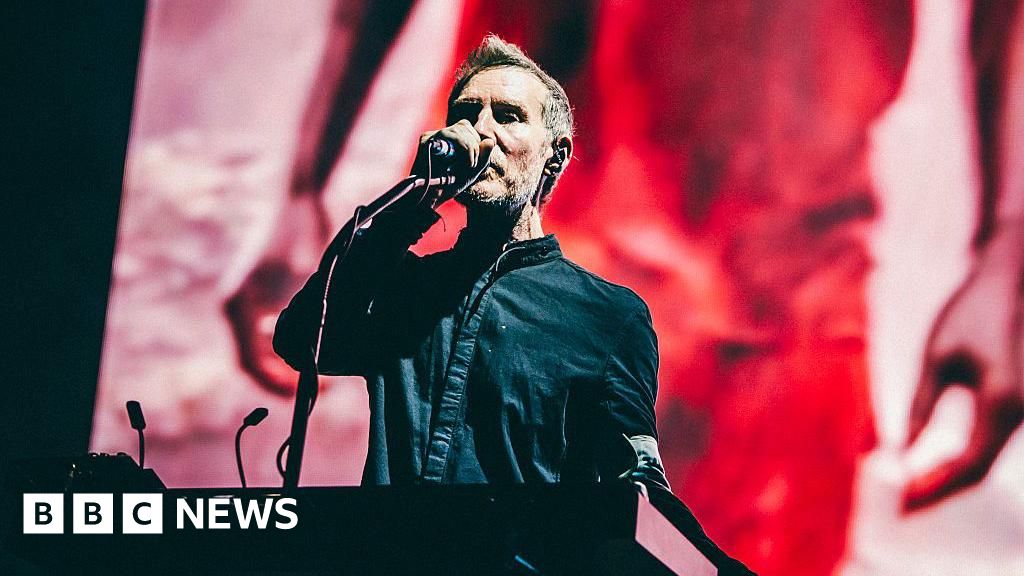 Massive Attack investigated after reports of pro-Palestinian display in Singapore show - BBC