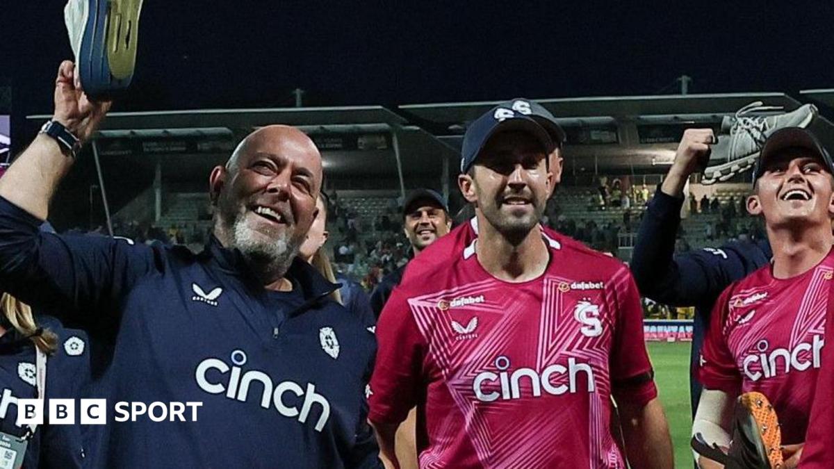 Darren Lehmann holds a trainer aloft during celebrations with his Northamptonshire Steelbacks players at the T20 Blast final