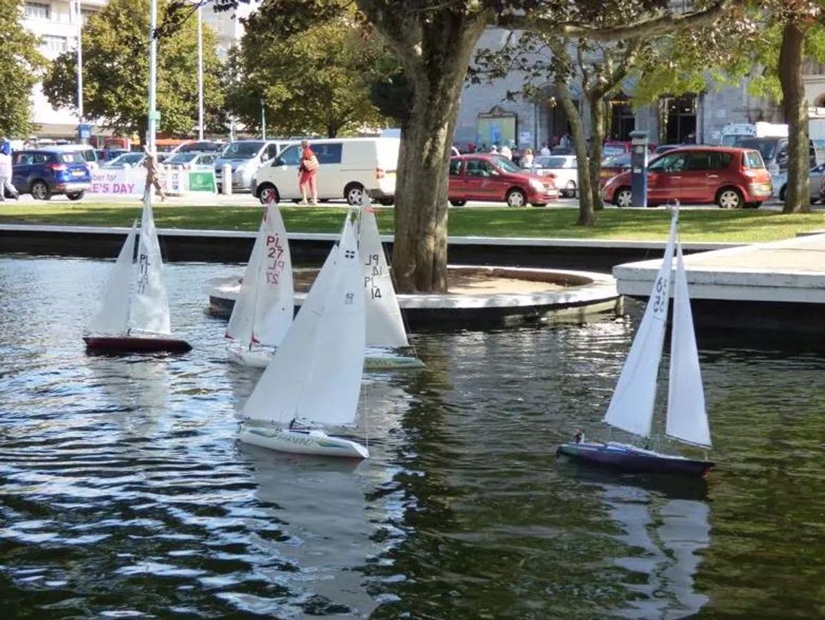 Boats bobbing about on the Civic Square pond before it was emptied and closed off