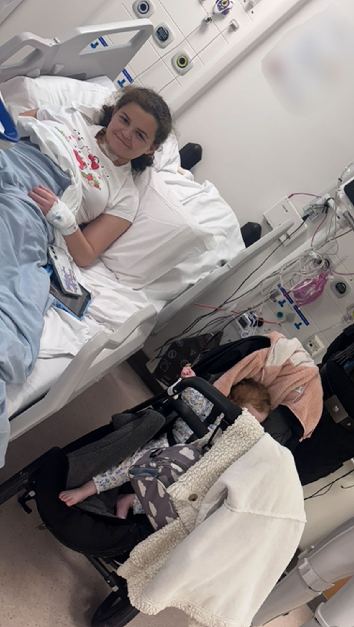 Tamelia in a hospital bed